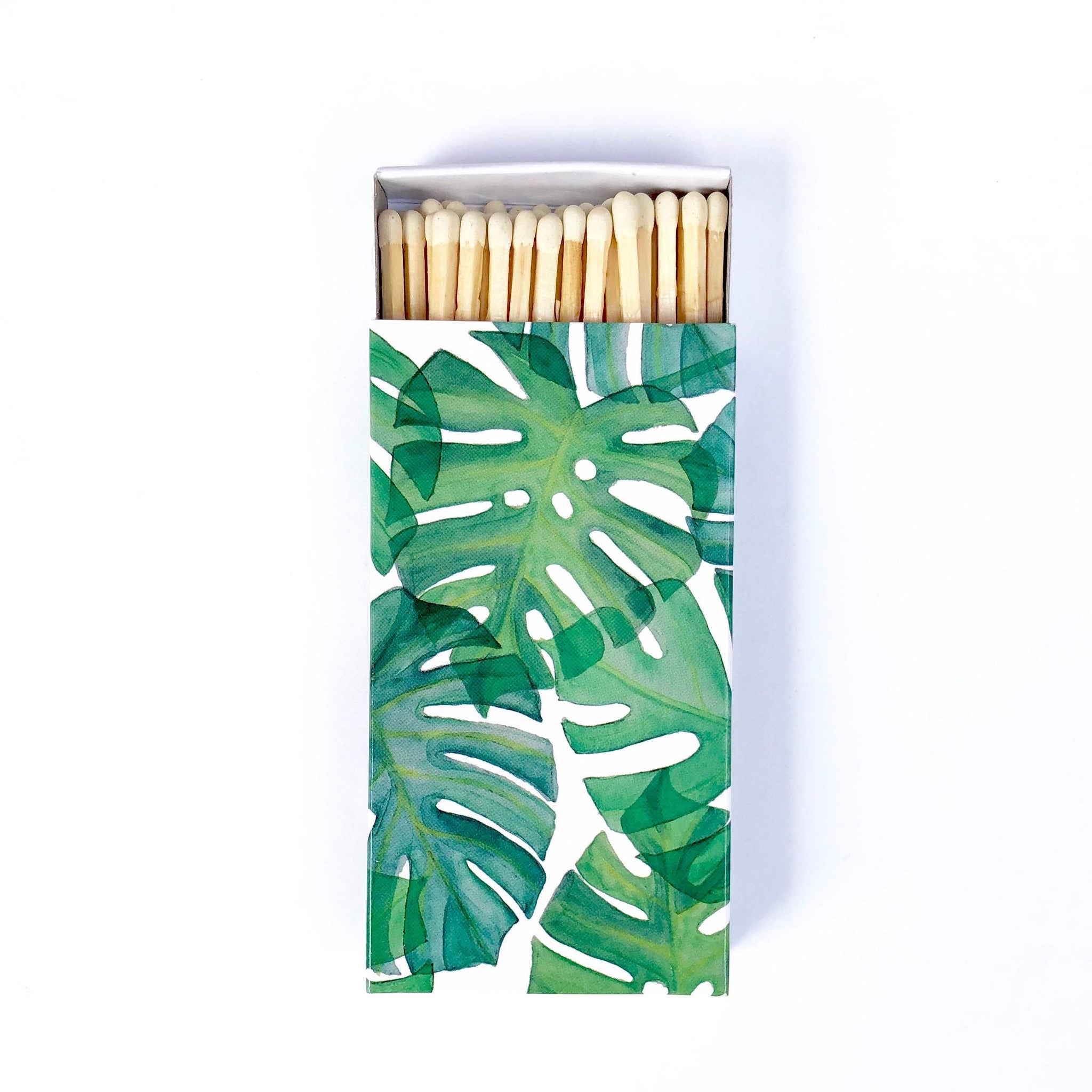 These monstera leaf jumbo matches are perfect for lighting our hand poured soy candles!  These decorative matches are a lovely addition to enhance any home décor.  Our designer match boxes are reusable, and each comes with 50 matches tipped in white.