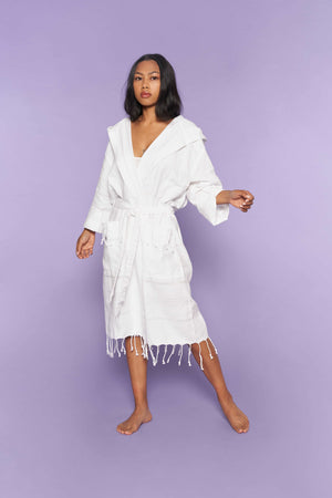 Hand loomed Turkish cotton bathrobe with tassels, pockets, and a hood.  In White.