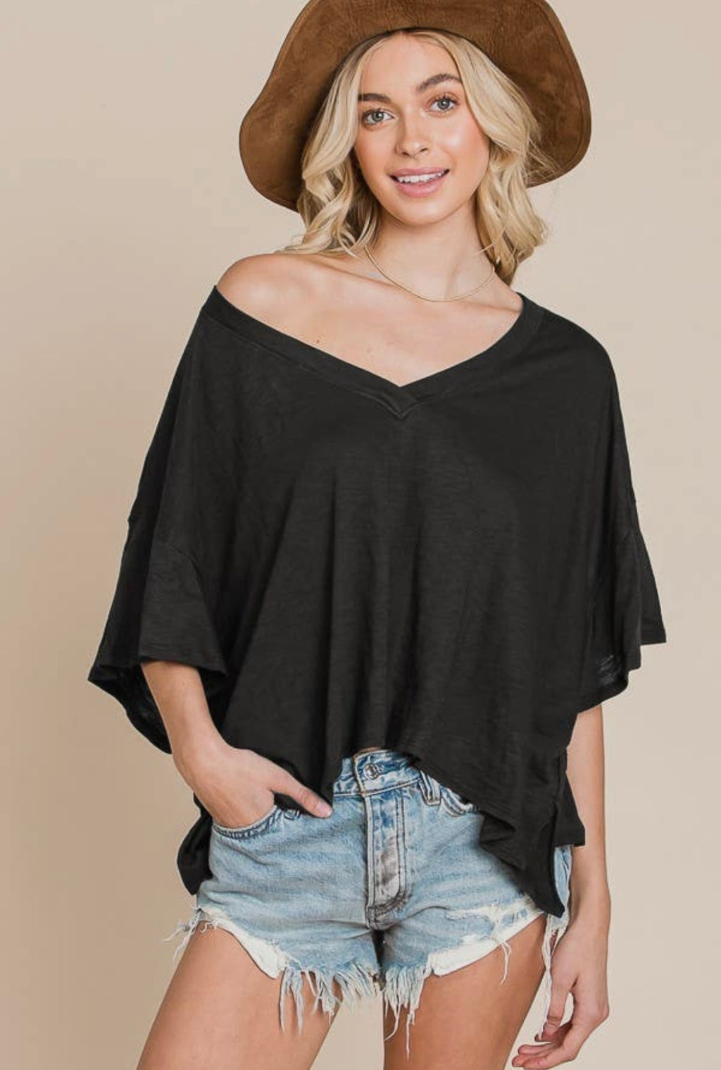 Be comfortable, stylish, and on-trend with our adorable V Neck Top. Crafted from 100% cotton, this essential piece is sure to become your go-to in any wardrobe. With its flattering v-neckline and versatile design, you'll love this cute, staple piece!