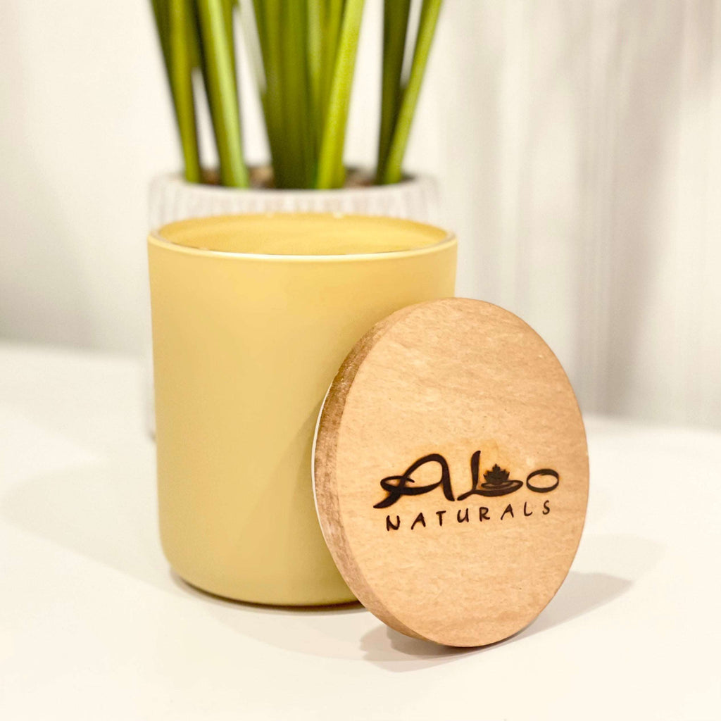 Sweetgrass and Jasmine scented soy candle.  Enjoy this fresh scent in a earthy yellow frosted glass vessel with a cotton wick and maple wood lid.  Gets over 70 hours of burn time!