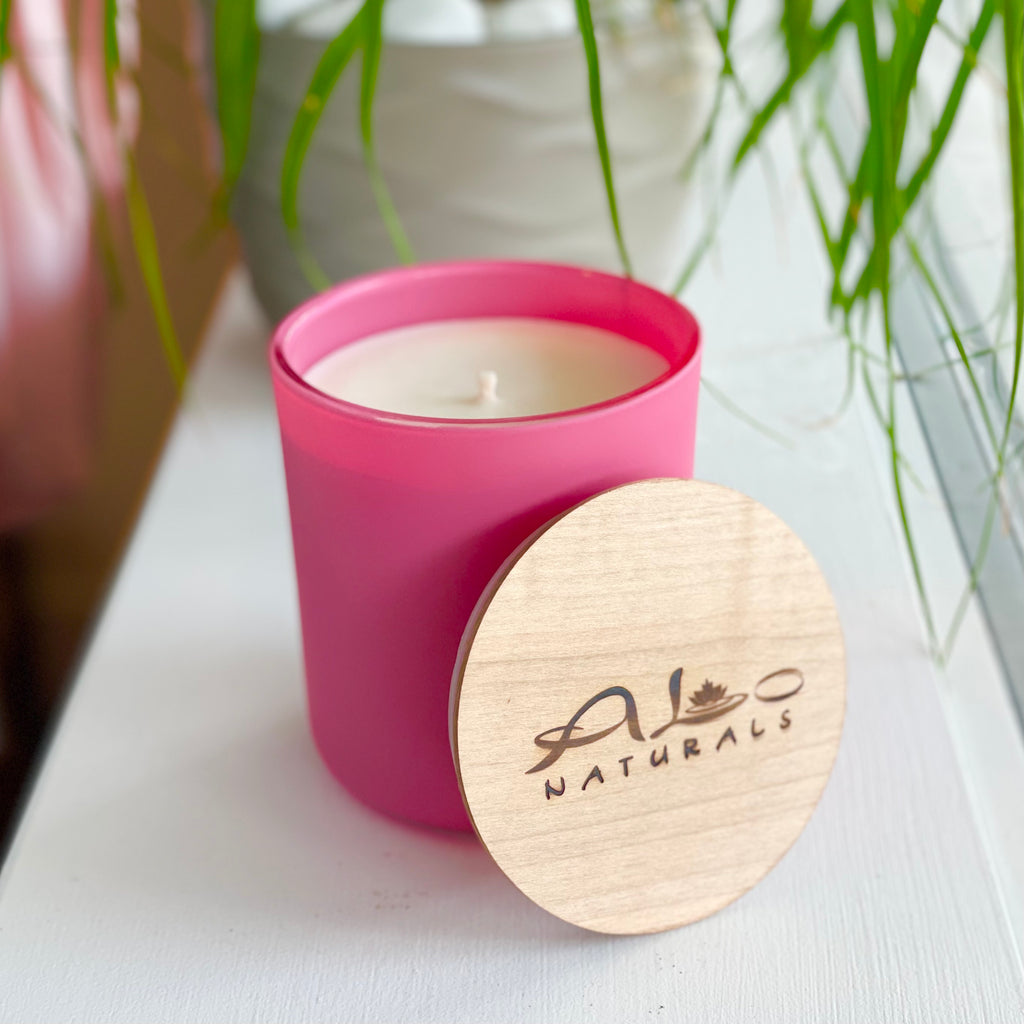 Pomelo & Apricot Rose scented candle.  Hand poured with 13 ounces of pure soy wax in a beautiful pink matte glass vessel.  Offers 80 hours of burn time.