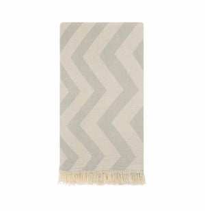 This beautiful chevron patterned towel is hand loomed from 100% Turkish Cotton. It is the traditional flat-woven towels that was used in the legendary Turkish bath. Known for its softness, absorbency, quick dry, light weight, hypoallergenic, and antibacterial properties. Perfect for everyday use after a bath, at the beach, pool, or picnic. Can also be tied around and worn like a sarong, shawl, or scarf! It folds up small making them perfect for travel.  Gray color.
