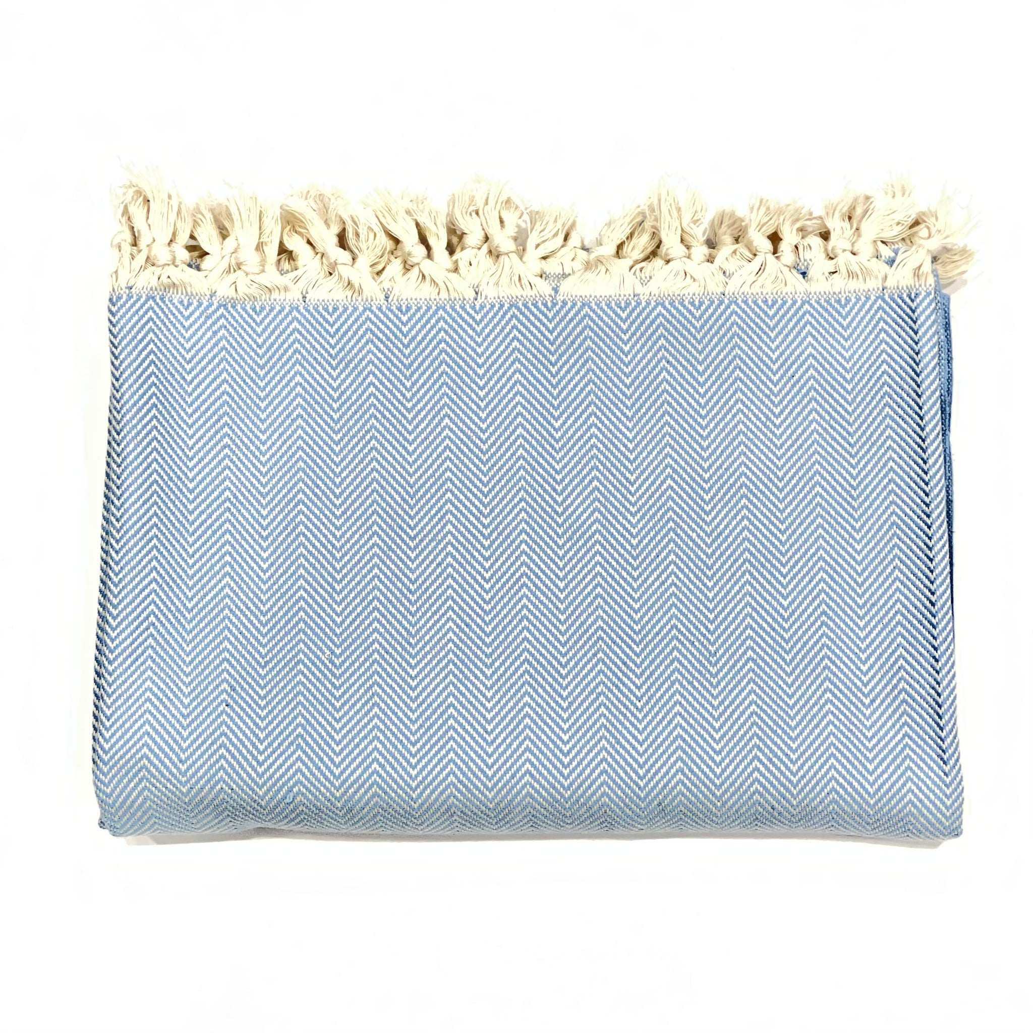 This beautiful throw blanket is hand loomed in a baby blue herringbone pattern with 100% Turkish Cotton. Known for its softness, comfort, light weight, hypoallergenic, and antimicrobial properties. Can be used as a throw blanket on a bed, couch, picnic, or even at the beach! Get ready to stay warm and comfy! Fair trade. Measure 71"x 94.5". XL King size. Perfect snuggle on the couch!