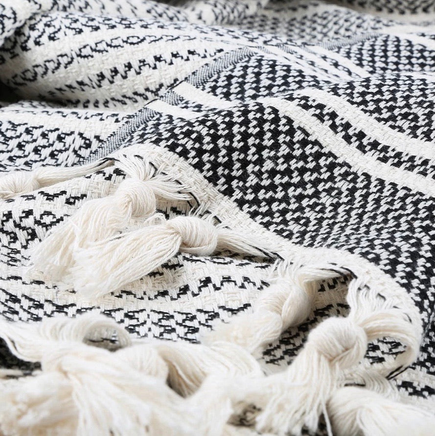 Ready to get cozy? This throw blanket is hand loomed with 100% Turkish cotton, in a stylish striped pattern of black and natural colors. Turkish cotton is known for its softness, comfort, light weight, hypoallergenic, and antimicrobial properties. It can be used as a throw blanket on a bed, couch, picnic, or even at the beach! Get ready to stay warm and comfy! Fair trade. Measure 71"x 94.5". XL King size.