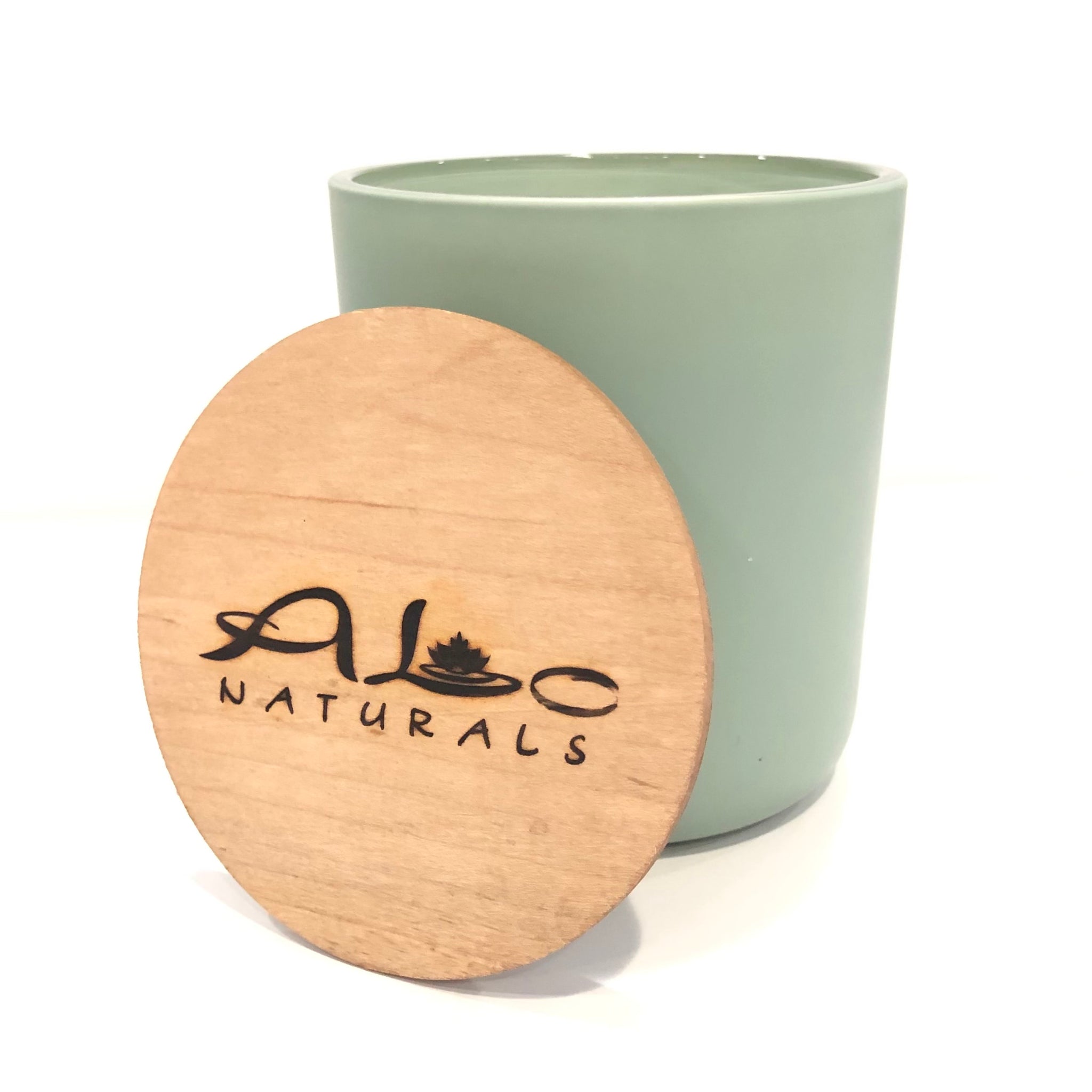 Hand poured Sage & Lavender scented soy candle.  Green painted glass vessel with wooden wick that crackles as it burns.  Includes a maple wood lid.  70 hours of burn time.