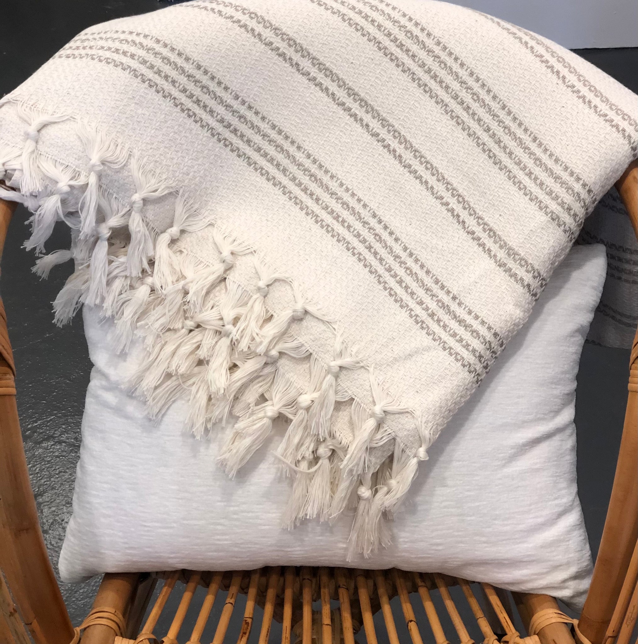 Ready to get cozy? This throw blanket is hand loomed with 100% Turkish cotton, in a stylish striped pattern of tan and natural colors. Turkish cotton is known for its softness, comfort, light weight, hypoallergenic, and antimicrobial properties. It can be used as a throw blanket on a bed, couch, picnic, or even at the beach! Get ready to stay warm and comfy! Fair trade. Measure 71"x 94.5". XL King size.