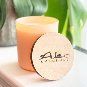 Hand poured soy candle with cotton wick and maple wood lid.  Peach glass vessel with the fresh scent of Georgia Peach!  13 ounces.  70 hour burn time.